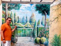 Craig in front of mural